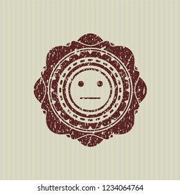 Red serious face icon inside distressed grunge stamp