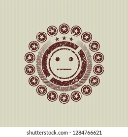 Red serious face icon inside rubber grunge texture seal