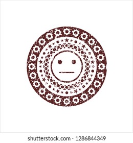 Red serious face icon inside distress rubber stamp