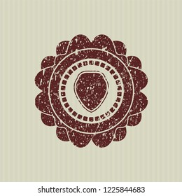 Red shield icon inside distress grunge stamp