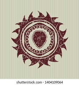 Red shield icon inside distress rubber seal with grunge texture