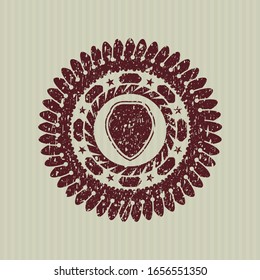 Red shield icon inside distressed grunge style stamp