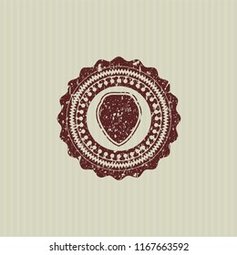 Red shield icon inside rubber seal