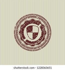 Red shield, safety icon inside distressed with rubber seal texture