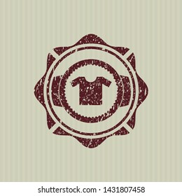 Red shirt icon inside distressed rubber seal with grunge texture