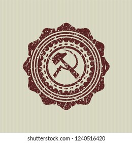 Red sickle and hammer icon inside distress grunge stamp