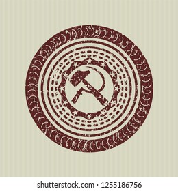 Red sickle and hammer icon inside distress grunge stamp