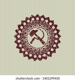 Red sickle and hammer icon inside grunge stamp
