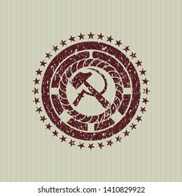 Red sickle and hammer icon inside distressed with rubber seal texture
