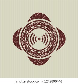 Red signal icon inside distress rubber seal with grunge texture