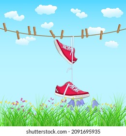 Red sneakers hanging on rope. Shoes pair with white laces drying on line. Funky footwear hang from clothesline on blue sky and meadow background. Shoe dangle on laces. Stock vector illustration svg