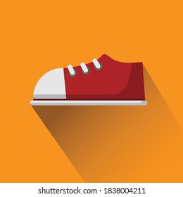 Red sneakers on orange floor.