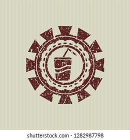 Red soda icon inside rubber seal with grunge texture