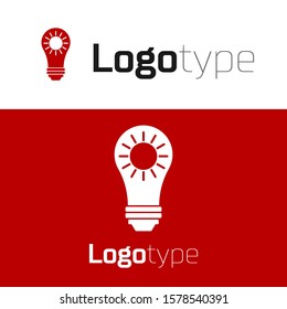 Red Solar energy panel icon isolated on white background. Sun and light bulb. Logo design template element. Vector Illustration