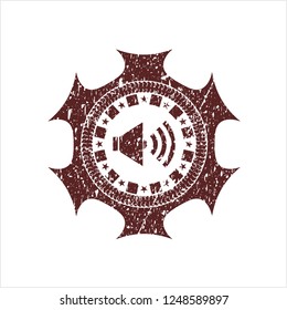 Red sound icon inside distressed rubber grunge stamp