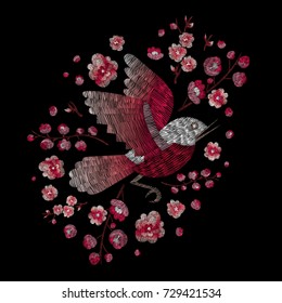 red sparrow and flowers cherry blossom. traditional stylish fashionable embroidered embroidery on a black background. sketch for printing on fabric, bag, clothes, accessories and design. trend vector