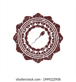Icono de esperma rojo dentro del precinto de caucho del colchón con textura gruesa. 