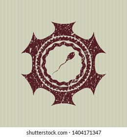 Red sperm icon inside distressed rubber grunge seal
