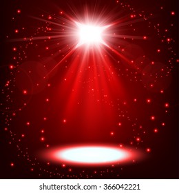 Red spotlight shining with sprinkles floating