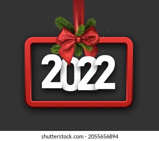 Red square christmas tree toy silhouette with white 2022 sign hanging on ribbon. Vector holiday illustration.