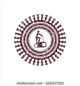 Red stationary bike icon inside rubber stamp with grunge texture