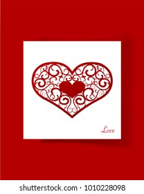 A red stencil heart on the white paper.