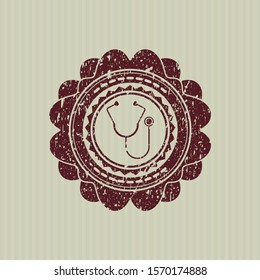Red stethoscope icon inside rubber grunge seal