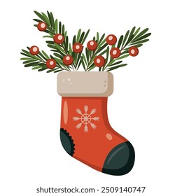 Red stocking with fir branches and red berries on them. The image has a festive and cheerful feel as it is a symbol of the Christmas season.