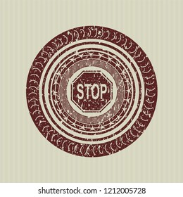 Red stop icon inside distressed rubber stamp