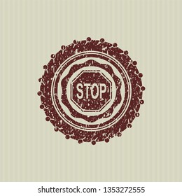 Red stop icon inside distressed rubber seal with grunge texture