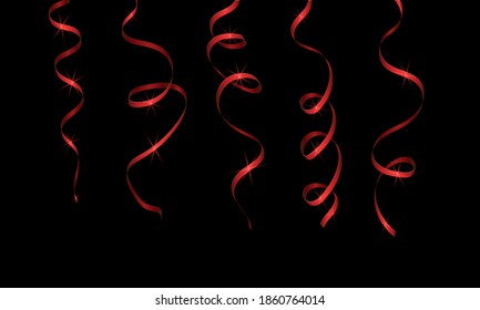 Red streamer ribbons with sequins on a black background. Decorations for any holiday.