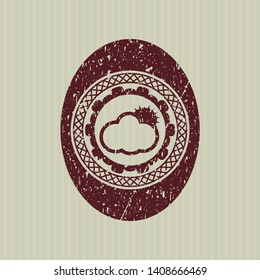 Red sun behind cloud icon inside distress rubber grunge texture stamp