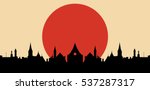 Red sun over city vector silhouette illustration