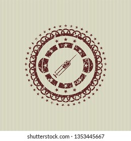 Red syringe icon inside rubber stamp with grunge texture
