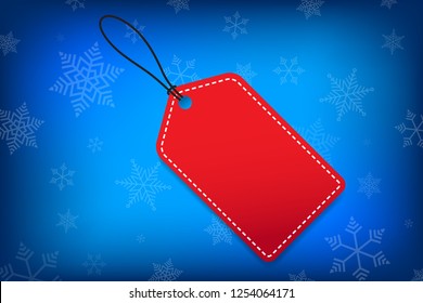 Red tag blank for your text vector banner design Christmas concept with snowflakes on blue background for use to your business website, gift card or product banner advertisements