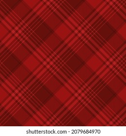 Red tartan plaid. Scottish argyle pattern fabric swatch close-up. 