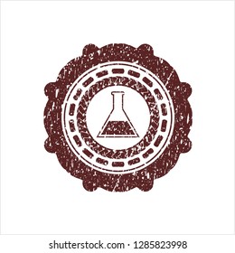 Red test tube icon inside rubber grunge seal