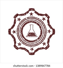 Red test tube icon inside distressed rubber seal
