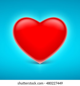 Red three-dimensional heart on blue background