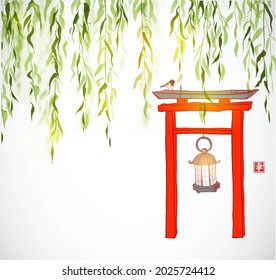 Red torii gate under the green willow tree. Japanese zen garden composition. Hieroglyph - happiness.