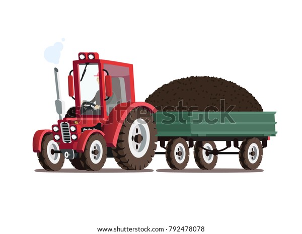 Red tractor with trailer. A pile of manure in\
the trailer.
