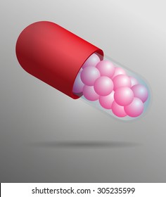 Red and transparent capsule with pink balls