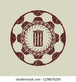 Red trash can icon inside distressed rubber texture