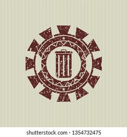 Red trash can icon inside distress rubber stamp with grunge texture