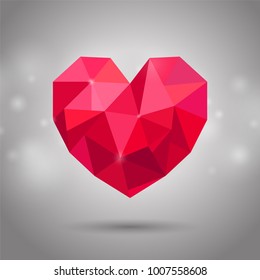 Red triangle or polygonal heart. Valentine's day, Mother's day, Wedding day symbol on shiny background
