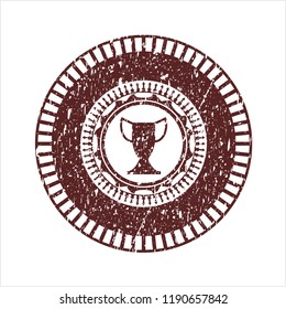 Red trophy icon inside distressed rubber grunge stamp