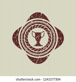 Red trophy icon inside distressed rubber texture