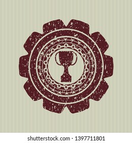 Red trophy icon inside grunge seal