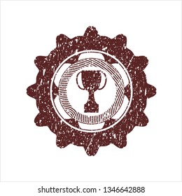 Red trophy icon inside rubber seal with grunge texture