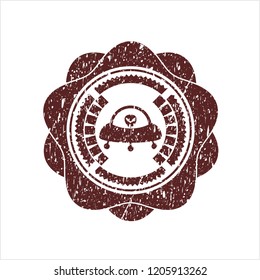 Red ufo with aline inside icon with rubber seal texture
